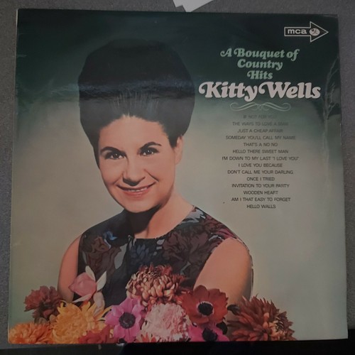 Kitty wells a bouquet - wells,